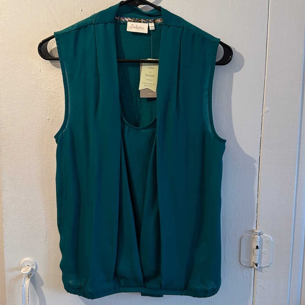 Sleeveless teal green blouse